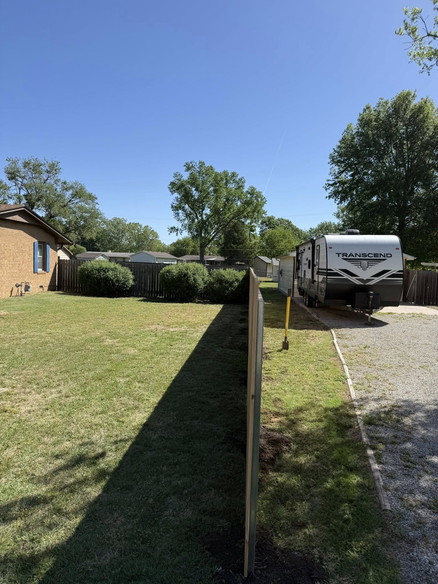 NC Fencing LLC crew installing fence posts