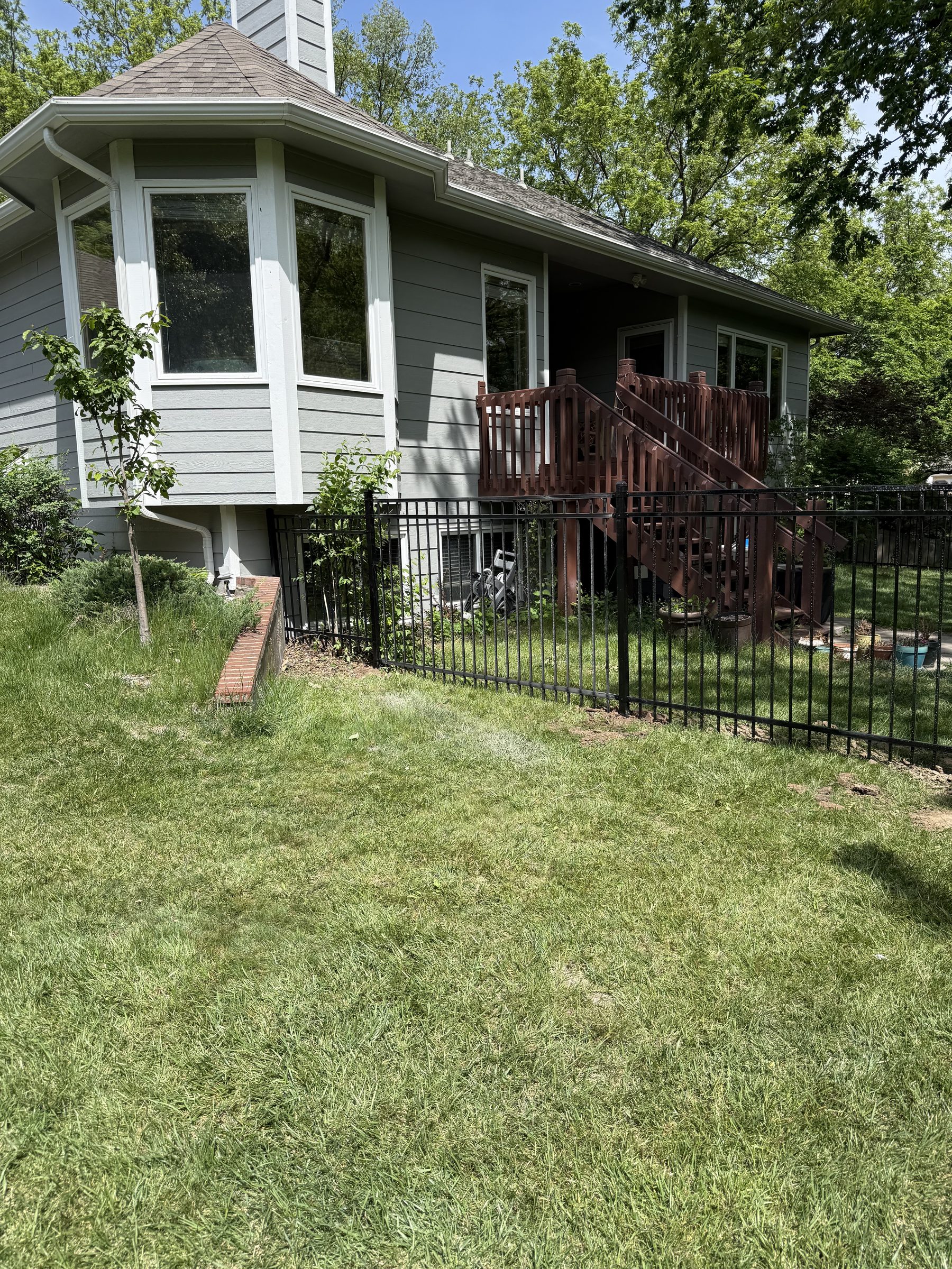 Cedar boards installed on wood fence