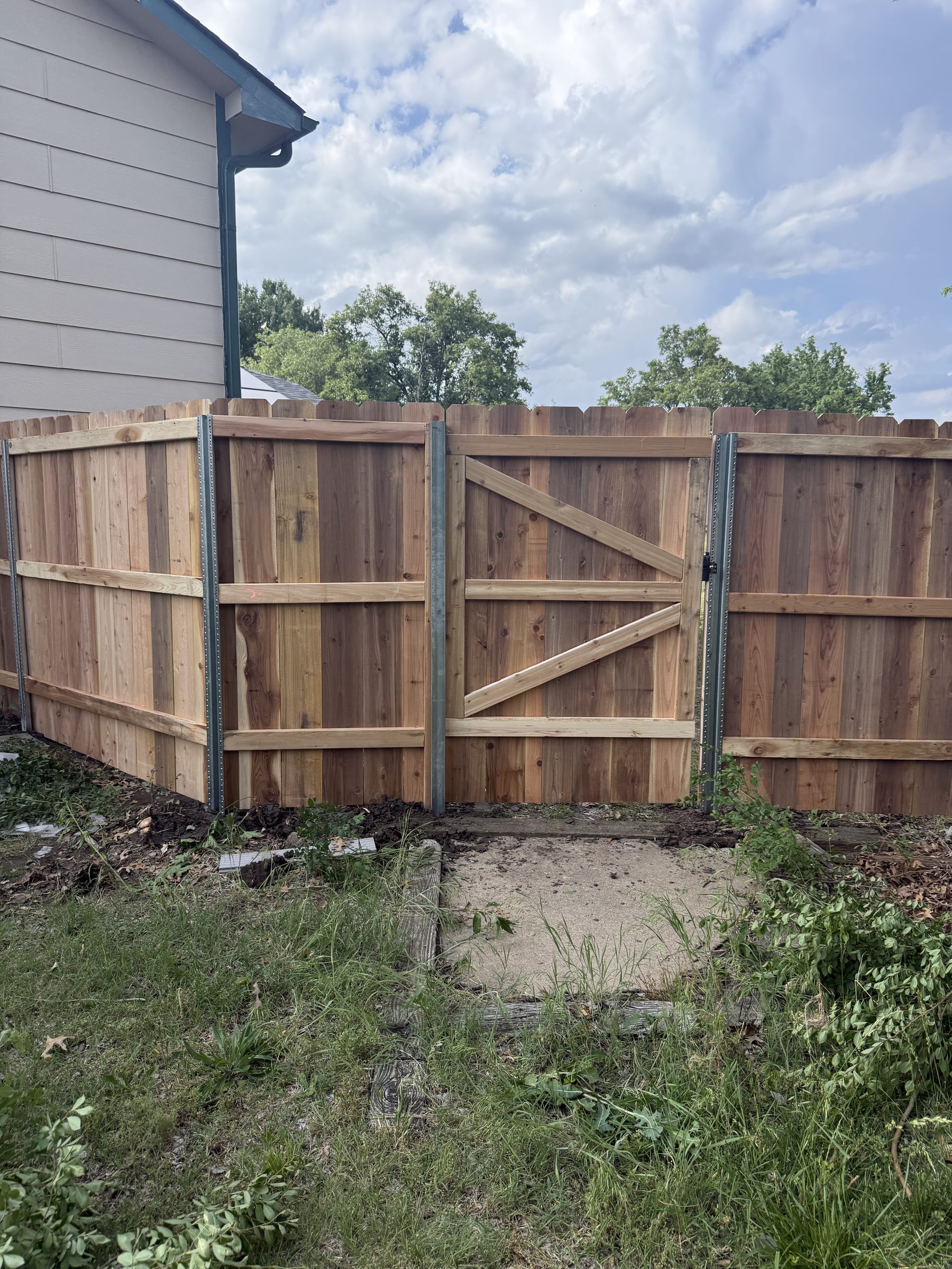 Cedar privacy fence enclosing backyard